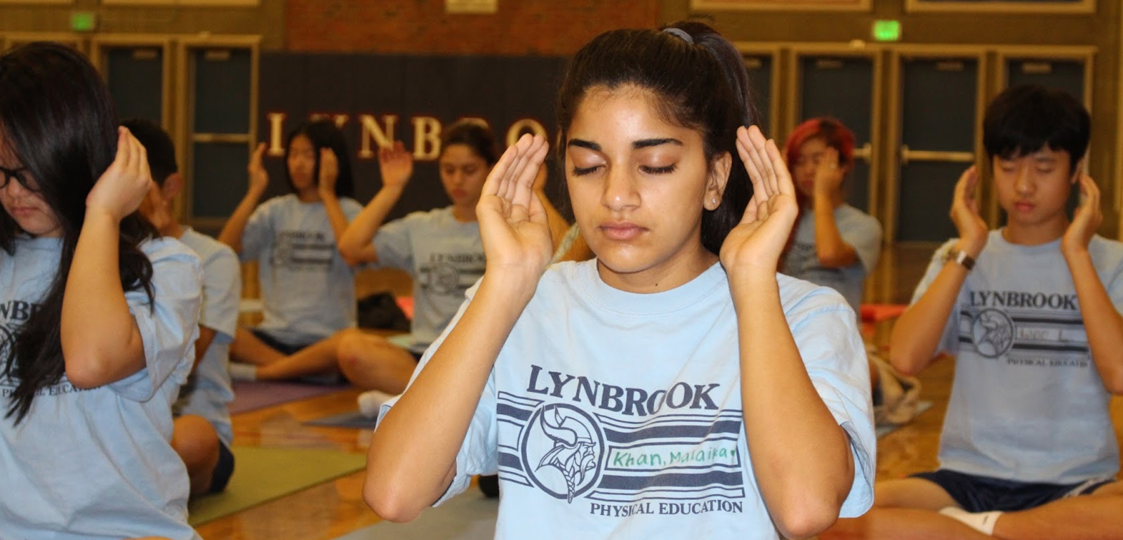 high school students practicing breathwork