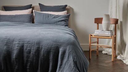 Best duvet covers from Bedfolk in ink blue with pink cushions