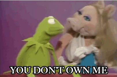 Miss Piggy slapping Kermit saying, "You don't own me!"