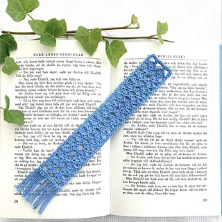 blue lace bookmark on open book