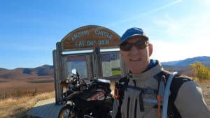 Rider snaps a selfie in front of the Arctic Circle Trail sign