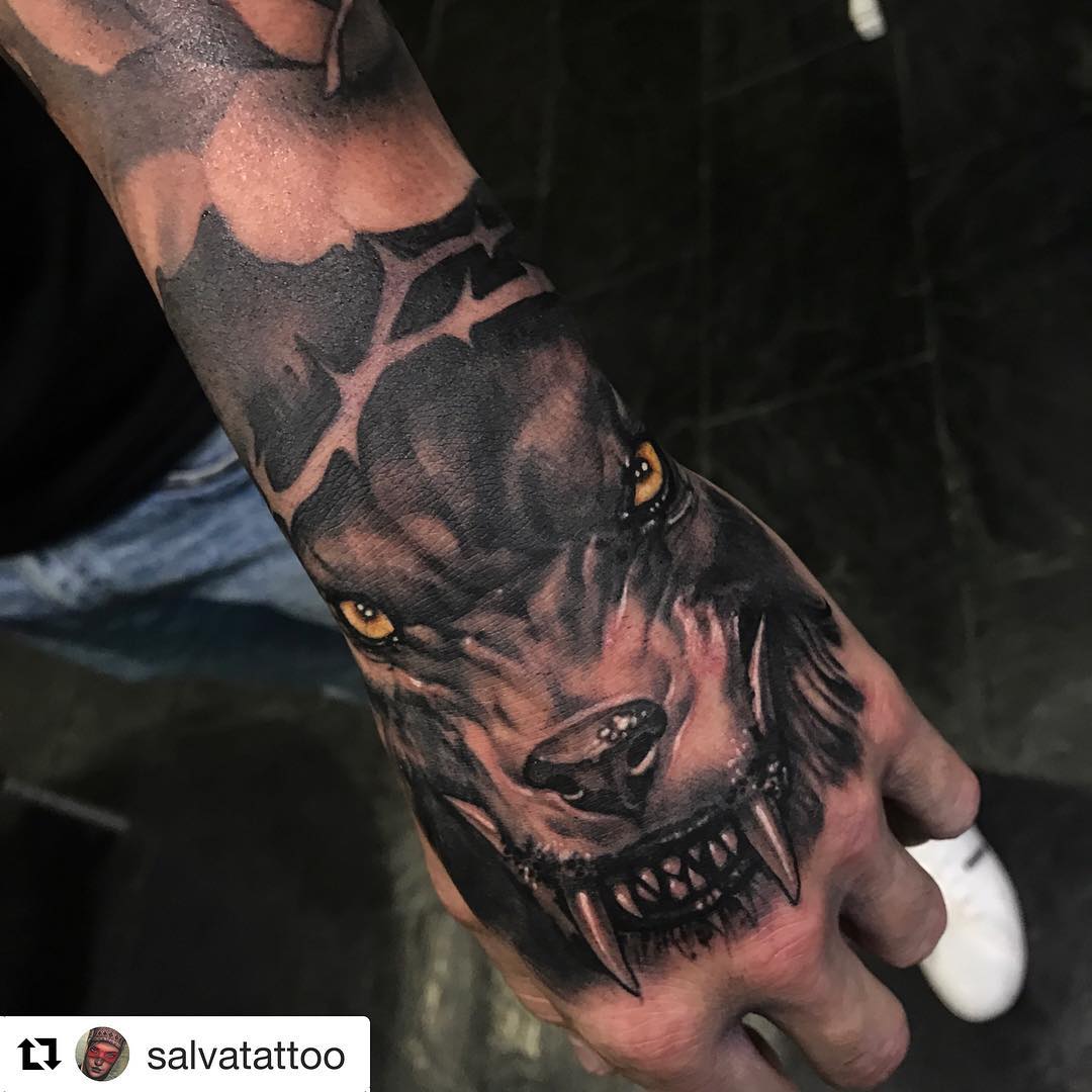 Yellow Eye Attacking Wolf Tattoo Design