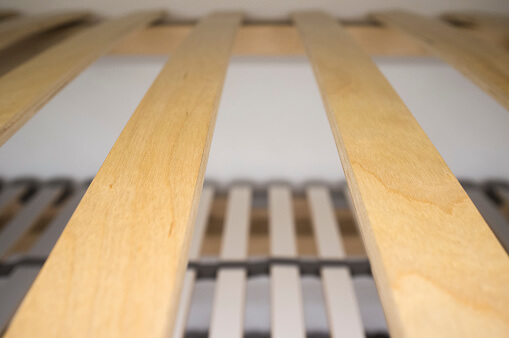 Can you put wood slats on a metal bed frame