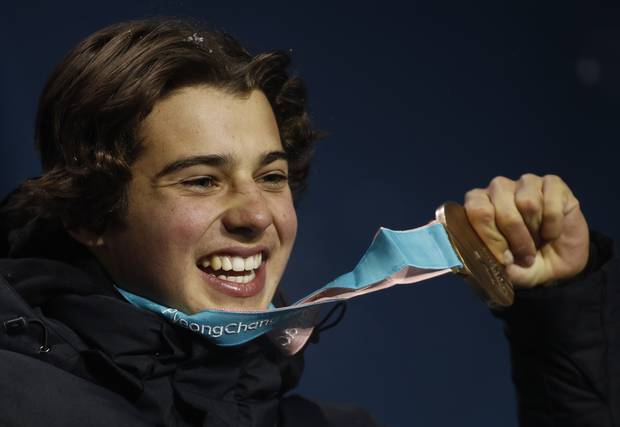 Bronze medalist in the men's halfpipe Nico Porteous, of New Zealand, smiles during the medals ceremony. Photo / AP