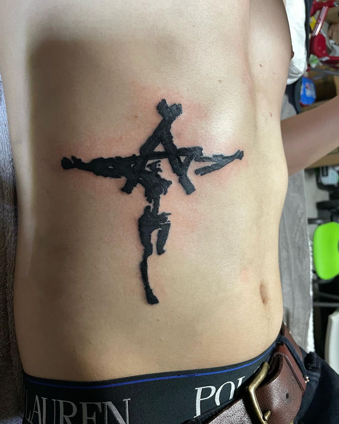 Jesus Christ Shaped Cross Tattoo On Rib