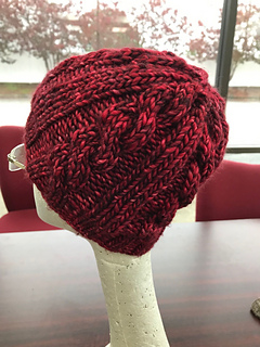 dark red chunky knit beanie on mannequin head