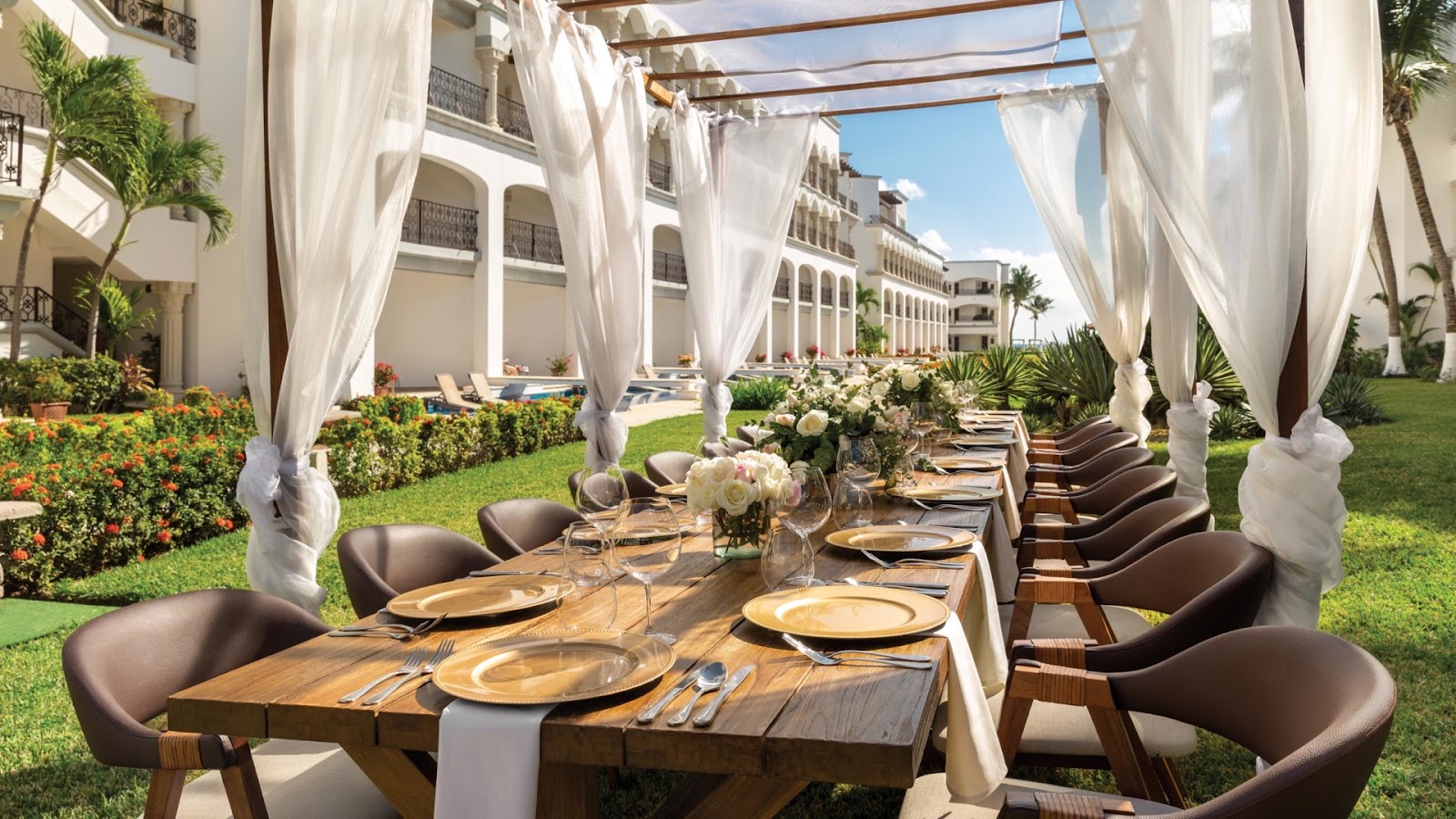 a tablescape at a reception held at the hilton destination wedding resort