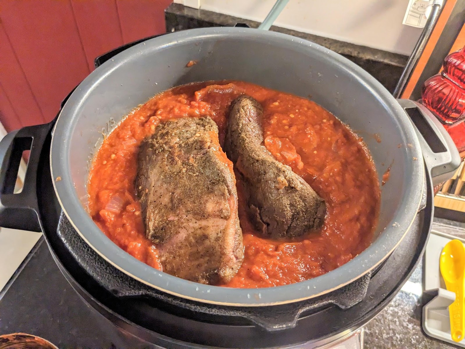 Two seared beef roasts in sauce in the Instant Pot