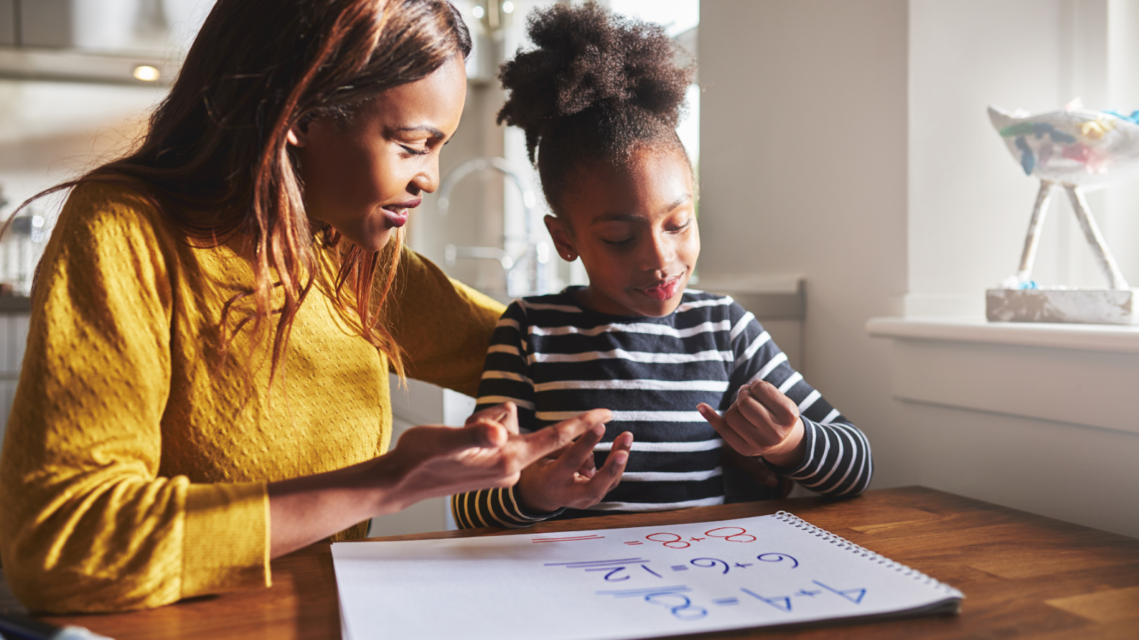 Mother and child doing math homework.