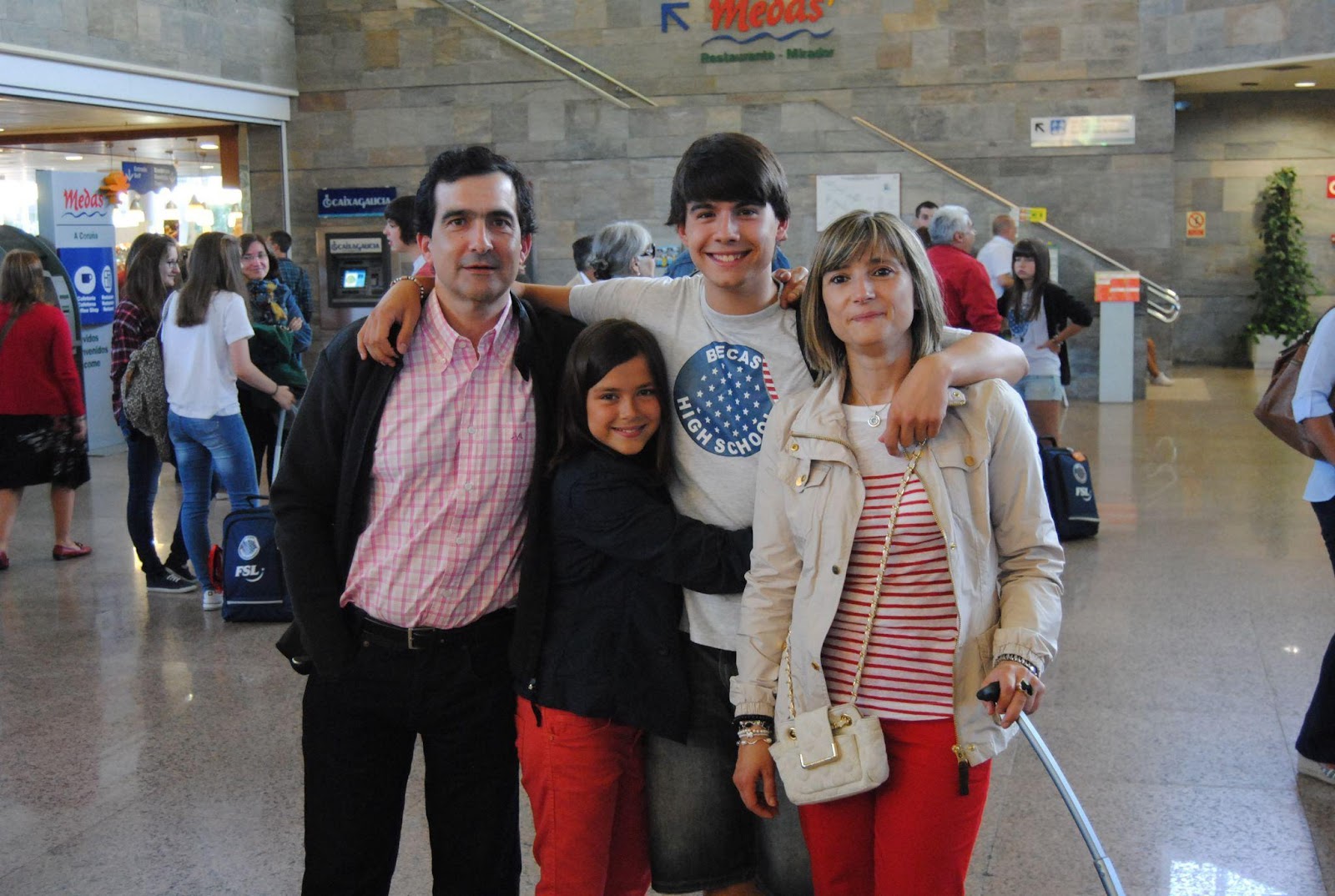 A family photo shows the author as a teen at the A Coruña airport with his family, about to leave for the US as an exchange student