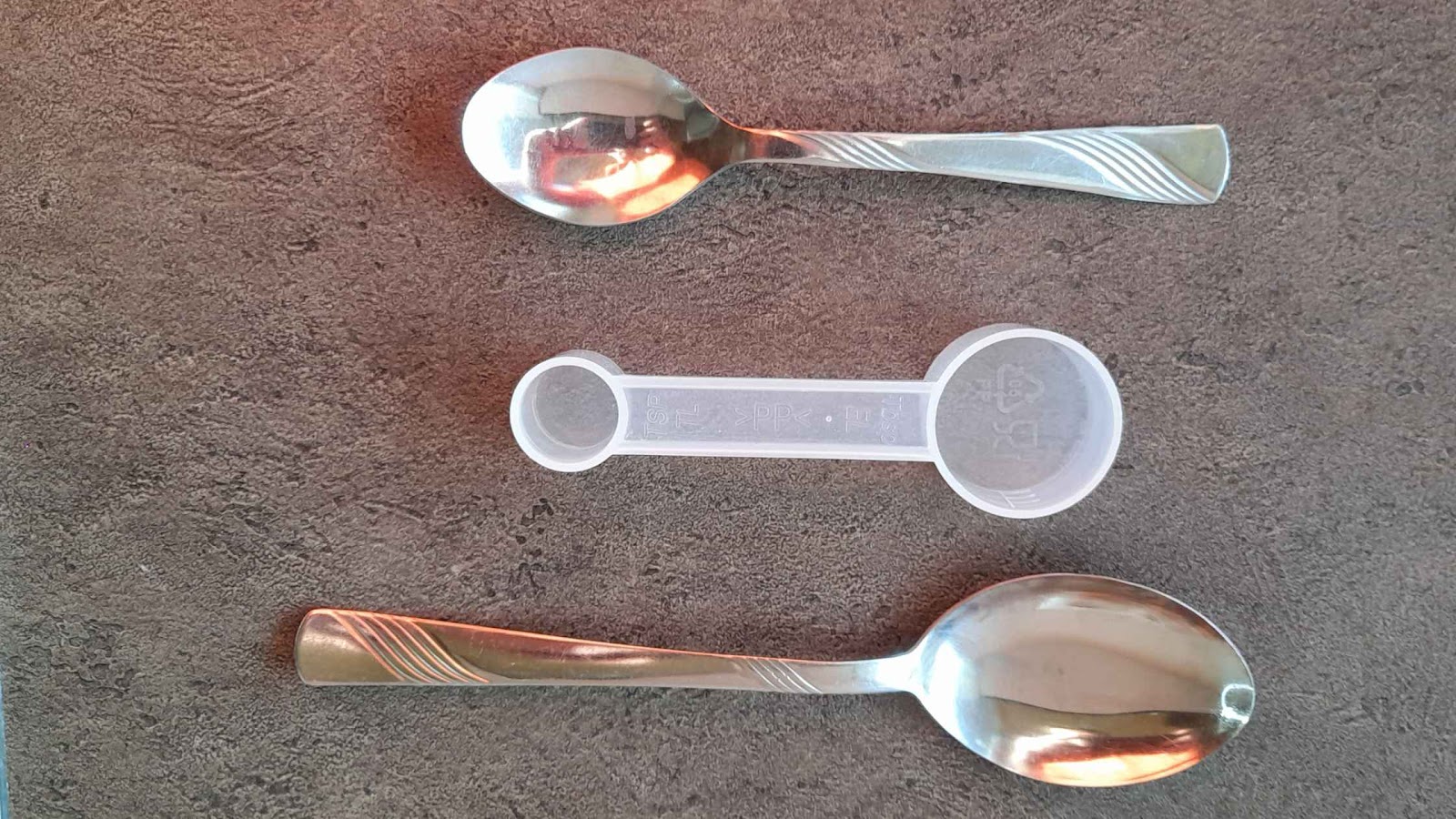 Tablespoon, teaspoon, and a measuring spoon.