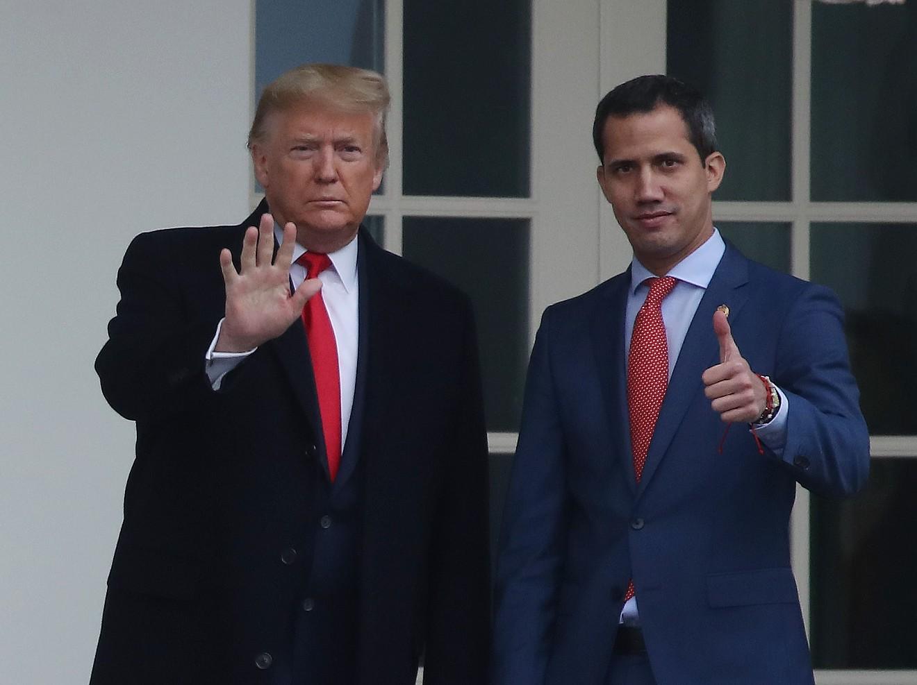 President Donald Trump walks with Juan Guaidó, interim president of Venezuela, at the White House February 5.
