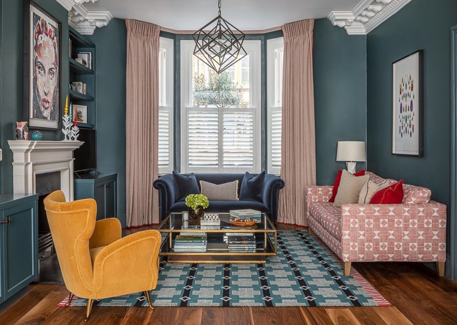 Inchyra Blue living room with pink curtains and sofas