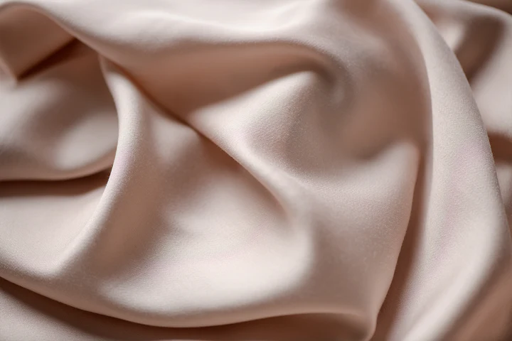 Close-up of rumpled peach-colored fabric