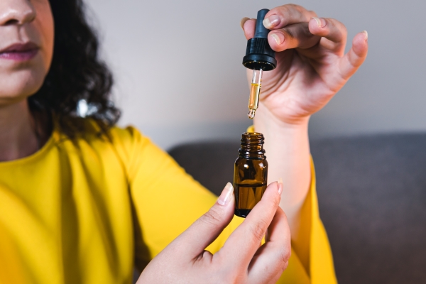 adult-woman-using-holding-medical-cannabis-oil-cbd