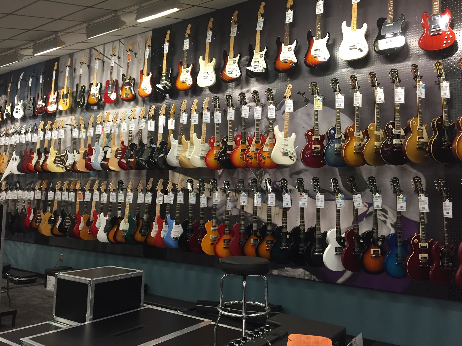 Production guitars on display in a music shop