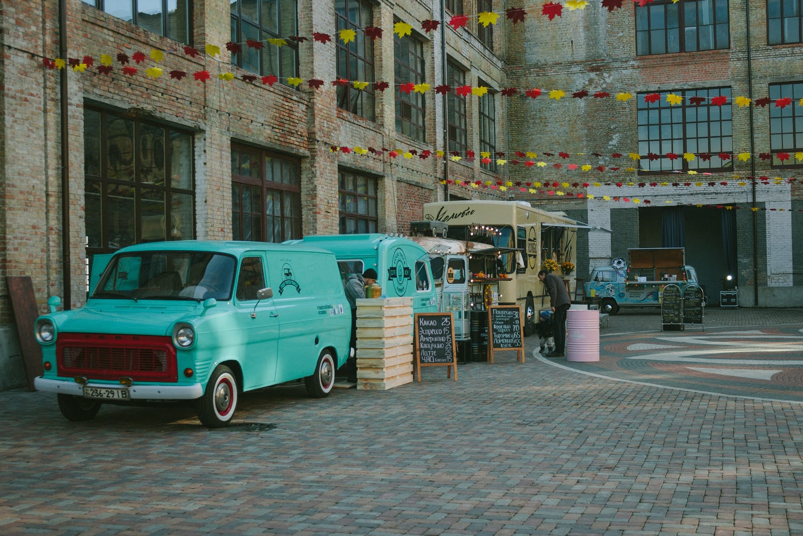 Startup business food trucks parked on a street.