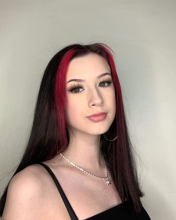 Gorgeous photo of a lady rocking the red an black hair