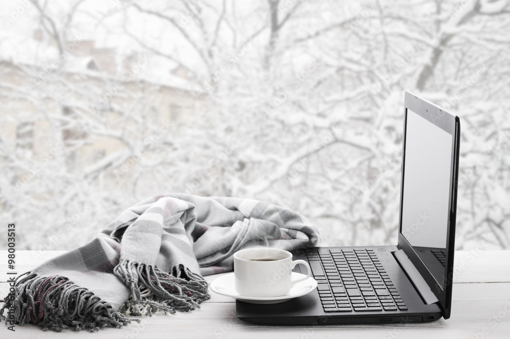 Beautiful scene of coffee in snowy place with Pc