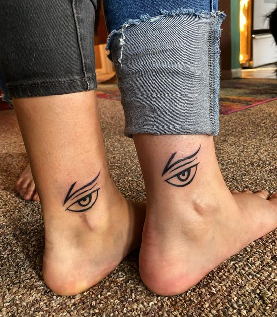Picture showing off the evil eye tat on two ankles