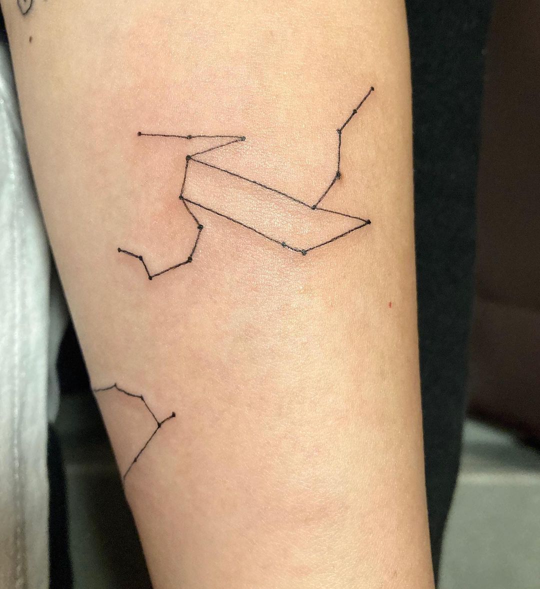 Simple Zodiac Inspired Constellations Tattoo On Forearm