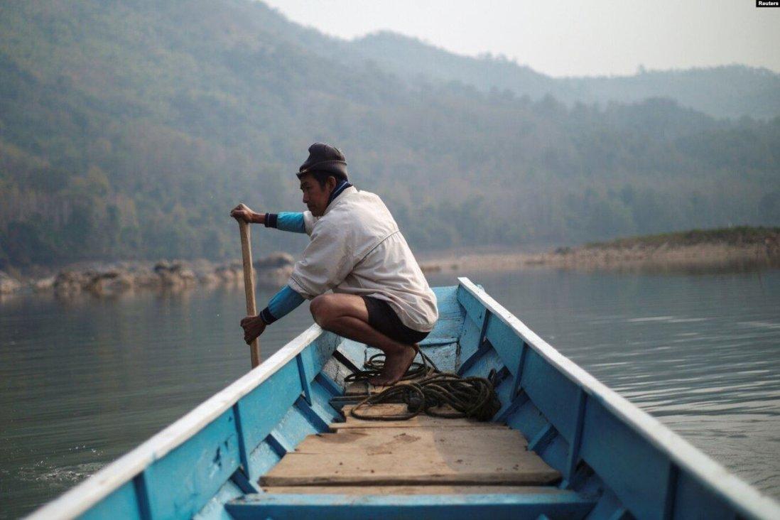 A villager rows a boat on the Mekong River, on the outskirts of Luang Prabang province in Laos. File photo: Reuters
