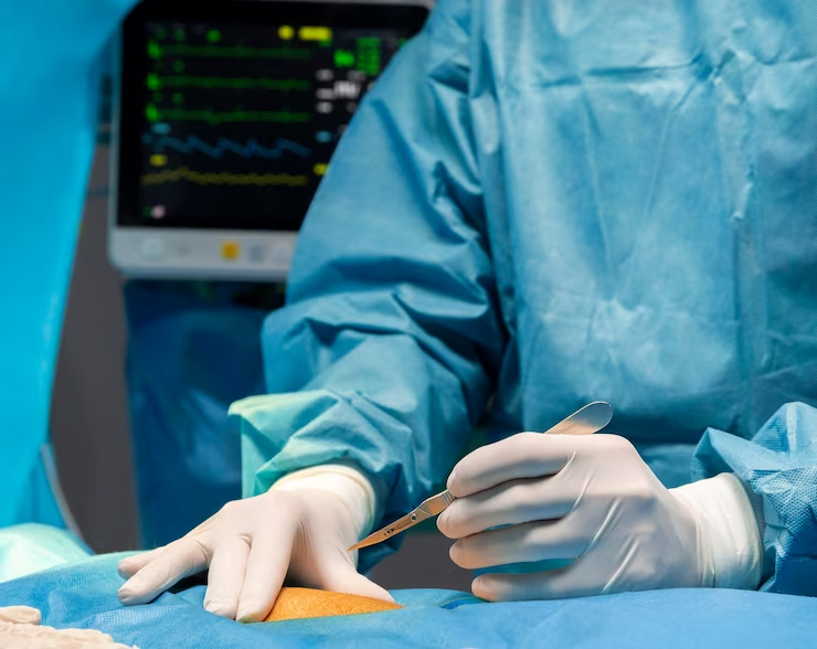 Surgeon performing surgery in an operating room.
