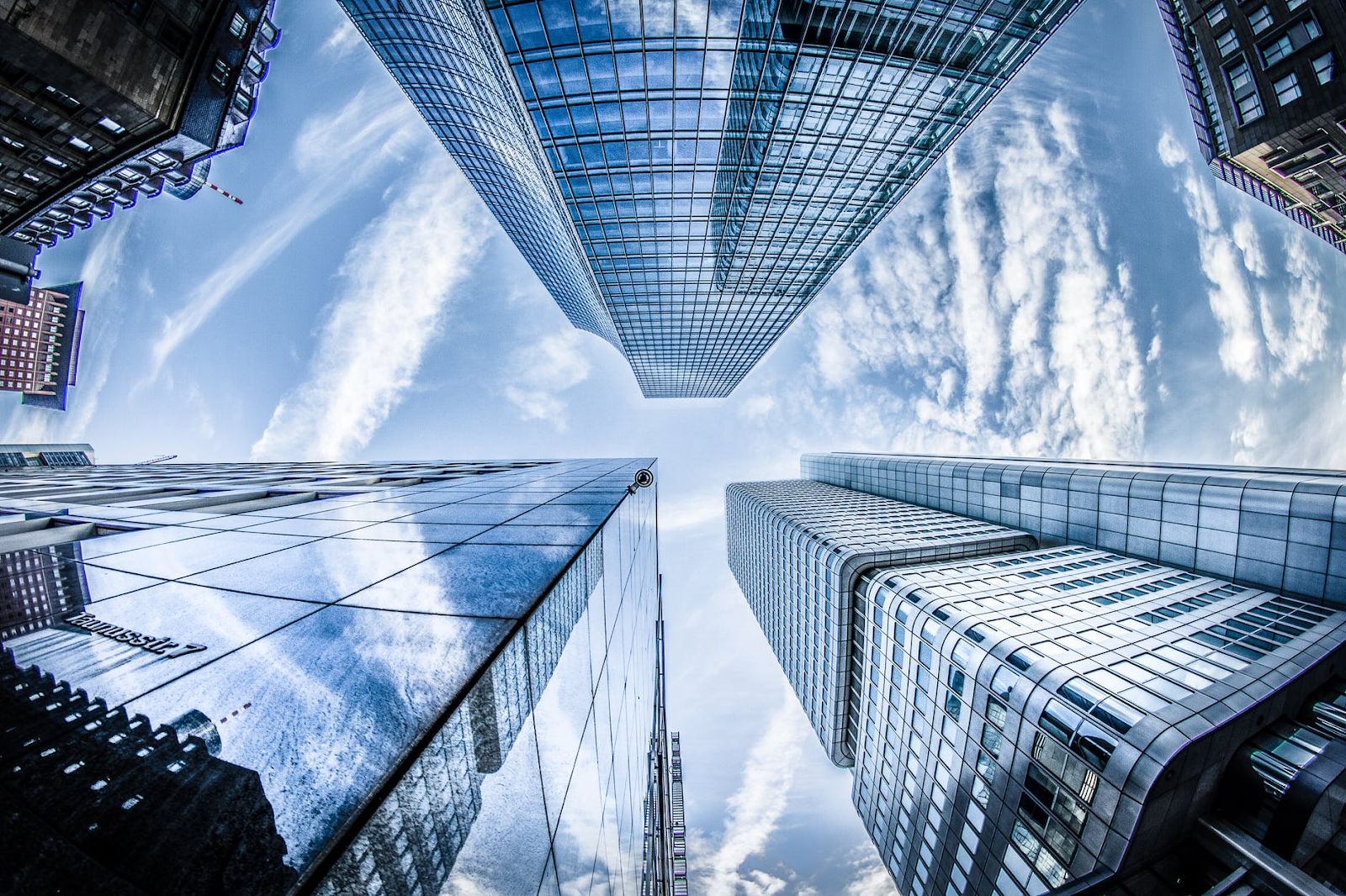 How to Improve the Aesthetic Look of your Business - Photo info: https://www.pexels.com/photo/low-angle-photo-of-four-high-rise-curtain-wall-buildings-under-white-clouds-and-blue-sky-830891/ 