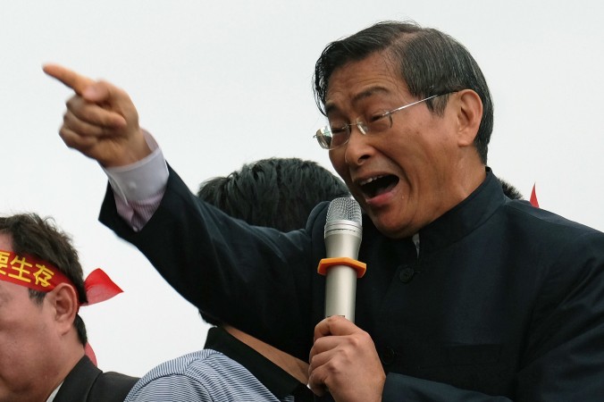 Chang An-lo, a pro-China activist also known as the 'White Wolf', gestures as he speaks during a demonstration to support the government and a controversial Taiwan-China trade pact in Taipei on April 1, 2014. (Sam Yeh/AFP/Getty Images)