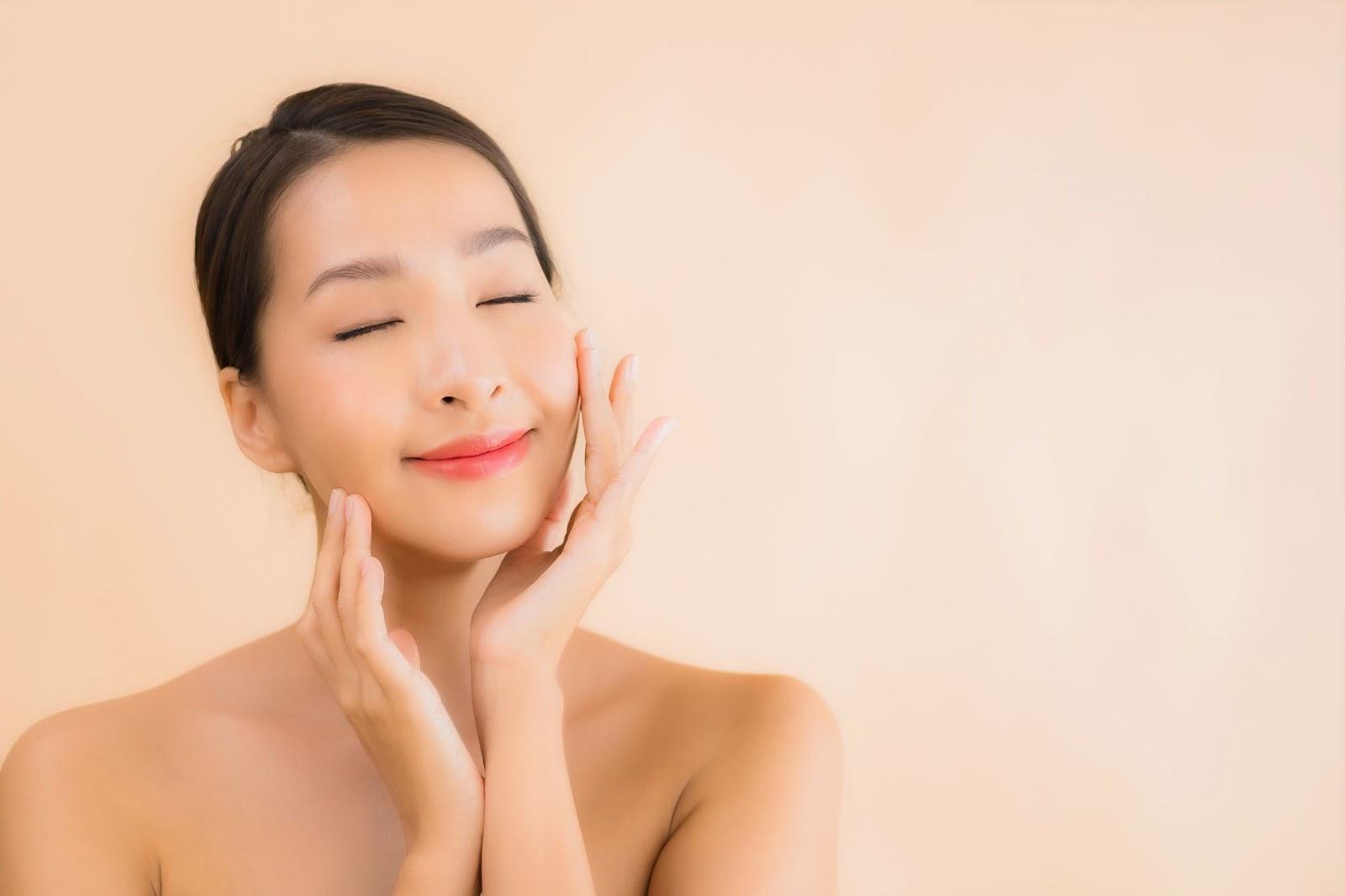 A person with the hands on the faceDescription automatically generated with low confidence
