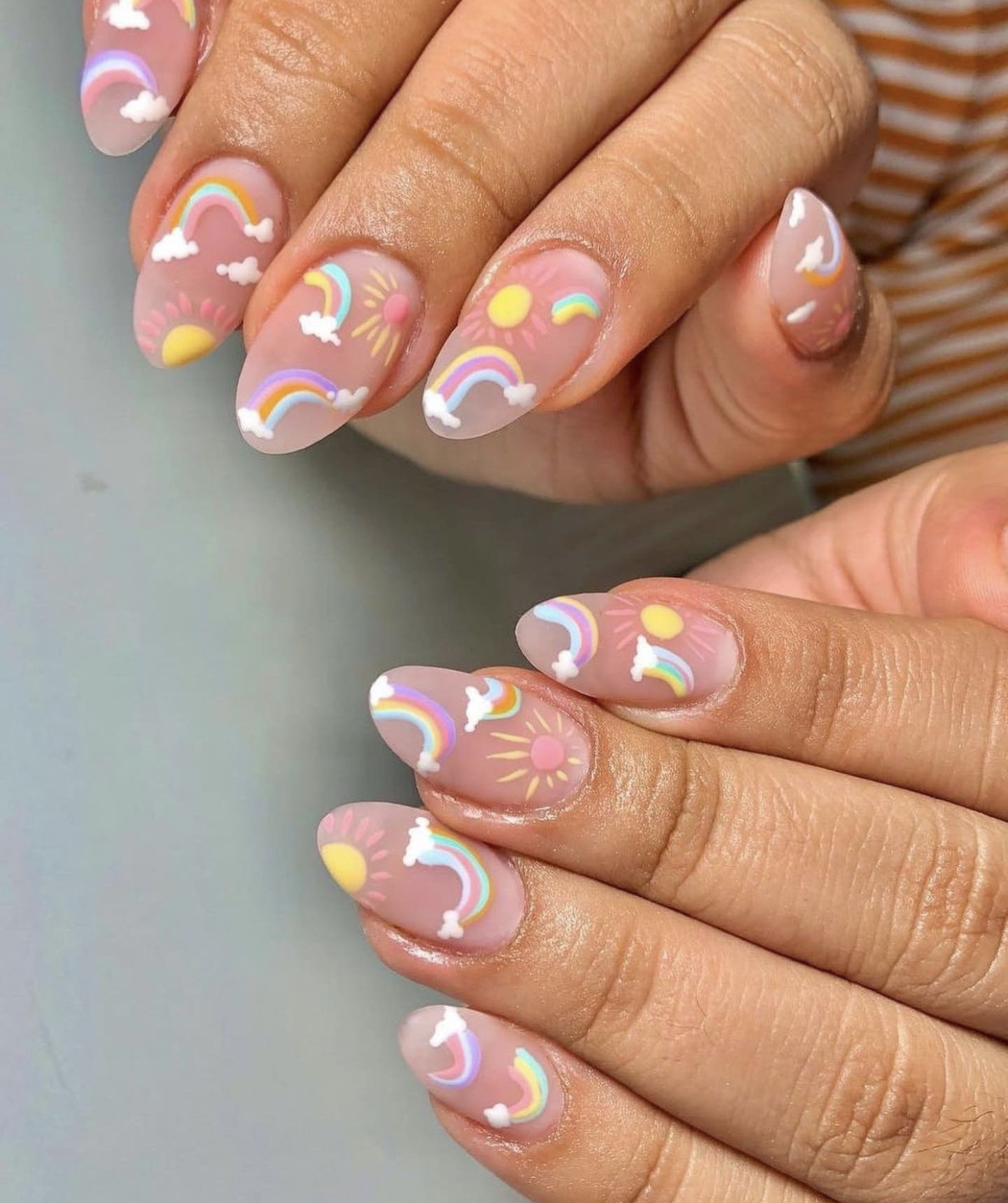 nails with mini rainbows and suns