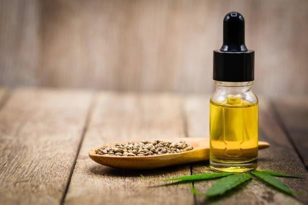 Hemp oil and hemp seeds on a wooden table, Medical marijuana products including cannabis leaf, cbd and hash oil, alternative remedy or medication,medicine concept. Hemp oil and hemp seeds on a wooden table, Medical marijuana products including cannabis leaf, cbd and hash oil, alternative remedy or medication,medicine concept. CBD oil stock pictures, royalty-free photos & images