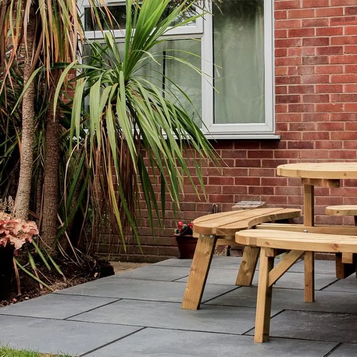 Amazon black slate paving with bench and palm trees