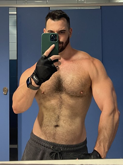 Thick Macho taking a locker room selfie at the gym shirtless and with workout weight lifting gloves