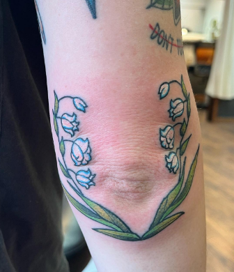 Elbow Wrap Lily Of The Valley Tattoo