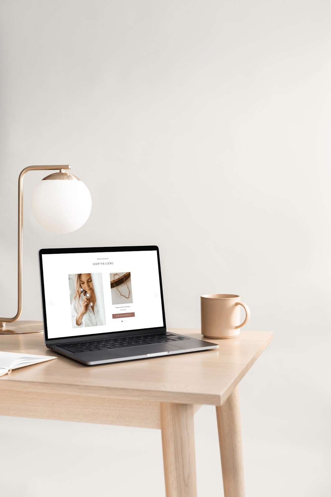 A desktop computer displaying a Shopify store designed by Shopify Web Designer Taylor Anne Creative.