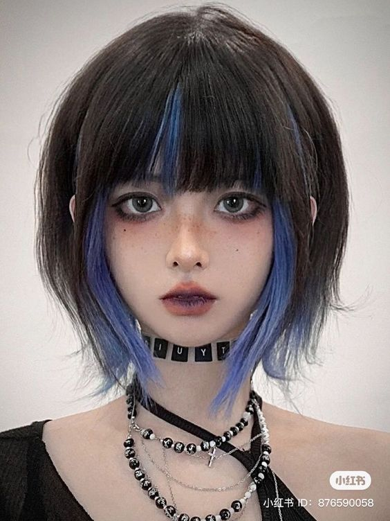lady wearing Asian short hair with blue highlights