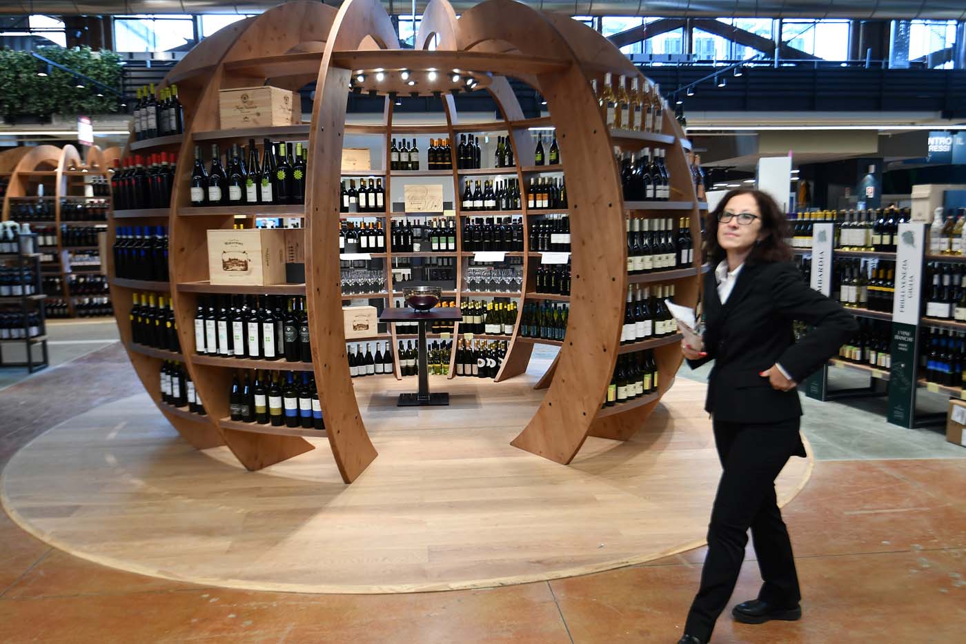 Italian wine is on display at a stand during a press tour at FICO Eataly World agri-food park in Bologna on November 9, 2017. FICO Eataly World, said to be the world's biggest agri-food park, will open to the public on November 15, 2017. The free entry park, widely described as the Disney World of Italian food, is ten hectares big and will enshrine all the Italian food biodiversity. / AFP PHOTO / Vincenzo PINTO