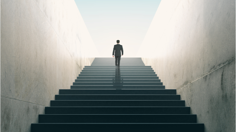 Man walking up stairs - growth concept