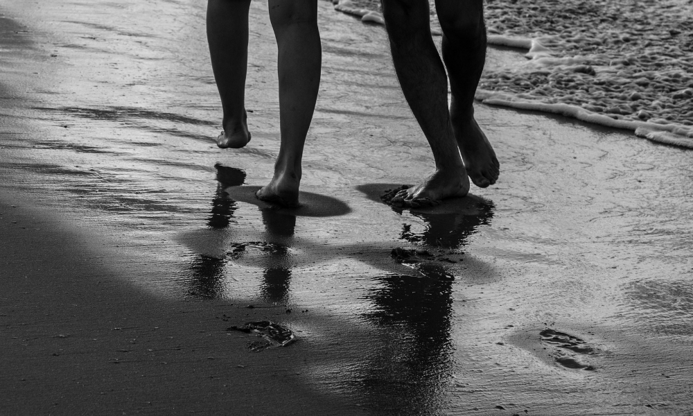 couple having a walk on the beach 