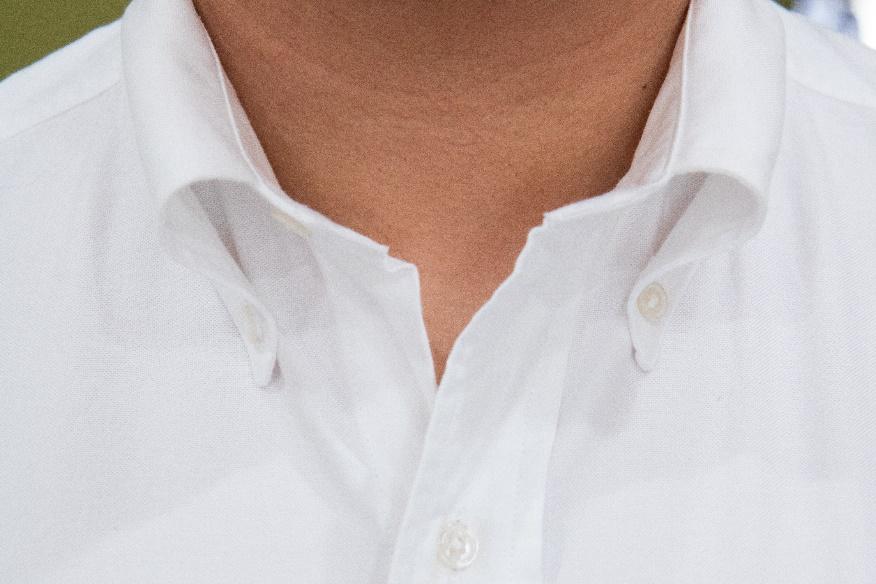 A close-up of a white shirt

Description automatically generated