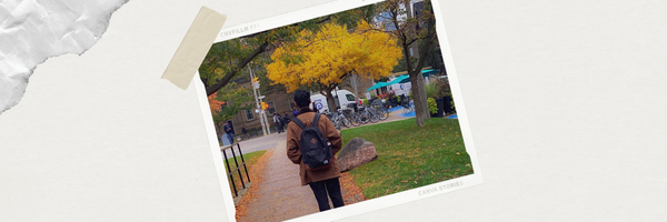 Student with a backpack taking a walk on a Fall day.