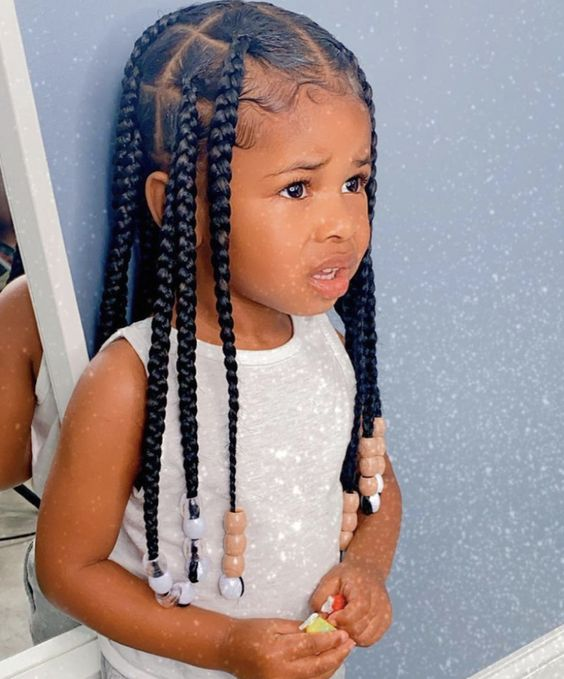 Full picture showing a baby girl rocking box braids