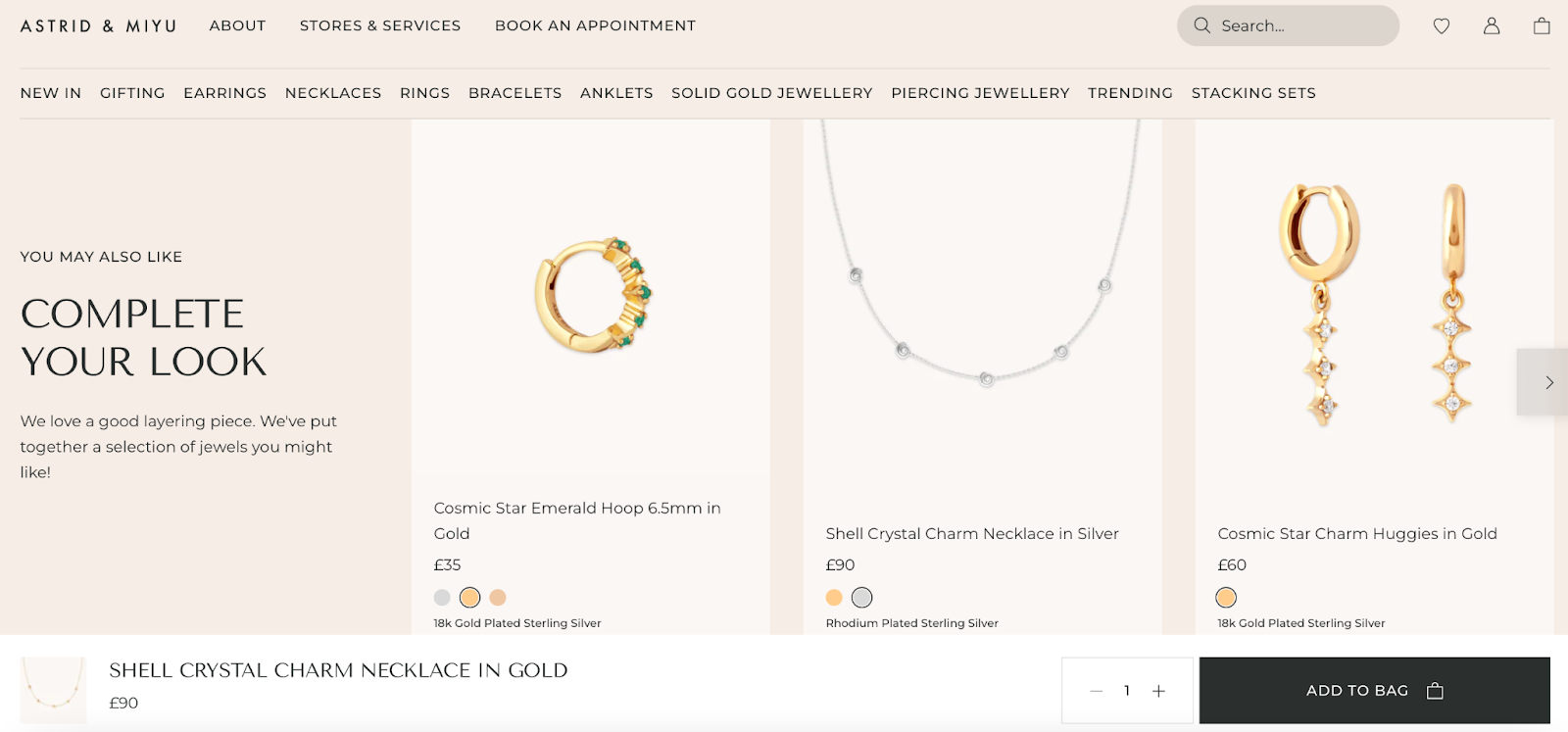 Screenshot of Astrid & Miyu jewelry website offering personalized content through AI. 
