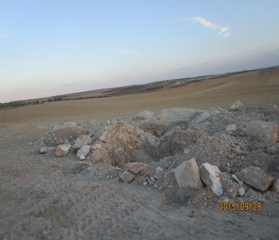 A pile of rocks in a desertDescription automatically generated with low confidence