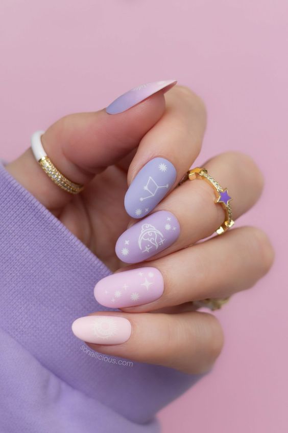 Different shades of purple pastel on summer nails
