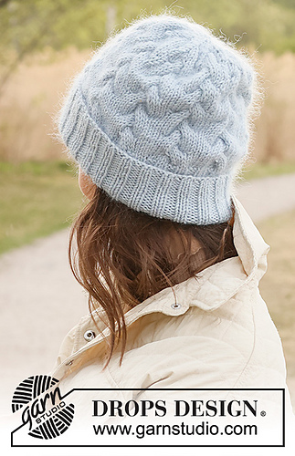woman wearing a light blue cable knit beanie