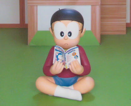 Nobita reading a Doraemon comic, from the 100 Years Doraemon Exhibit in Kuala Lumpur