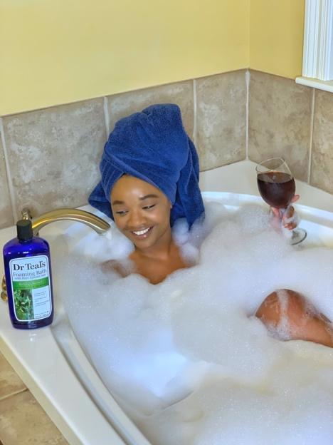 African American woman taking a bubble bath
