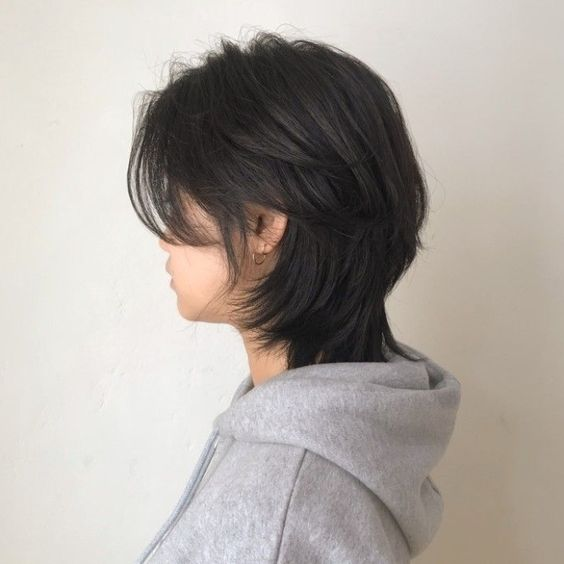 Side view of a girl rocking the korean wolf cut